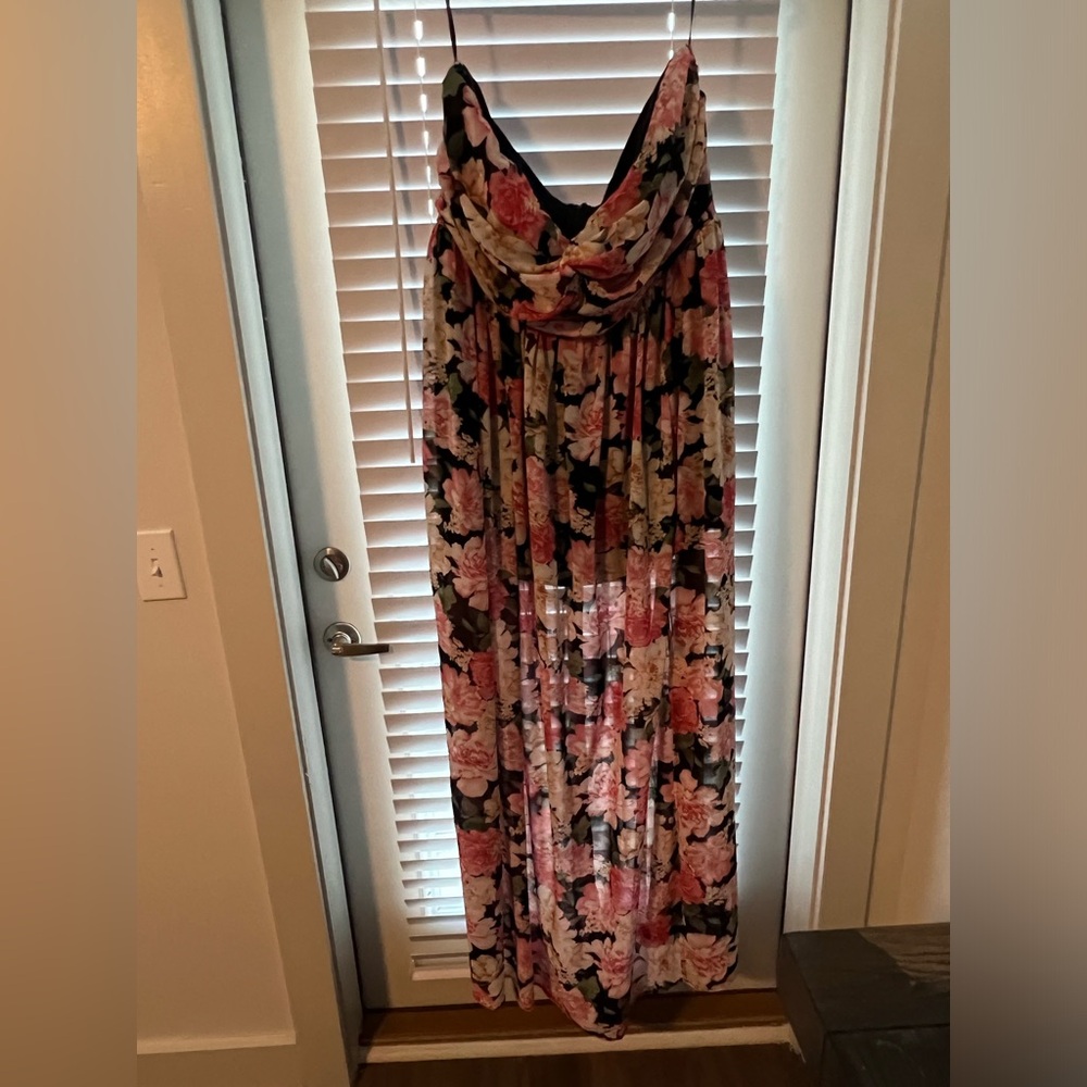 Floor length floral print strapless dress.